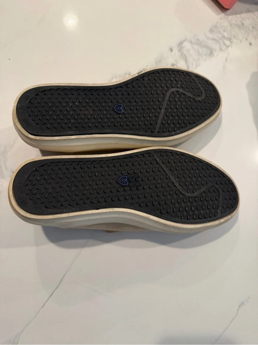 Rothy's Slip-On Flats in Tan with Blue Heel Accent